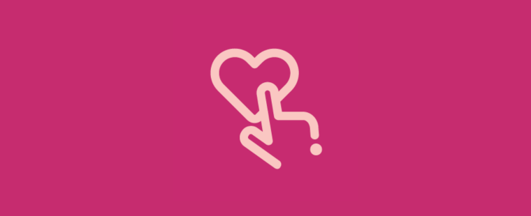 A finger touching a heart on a bright pink background